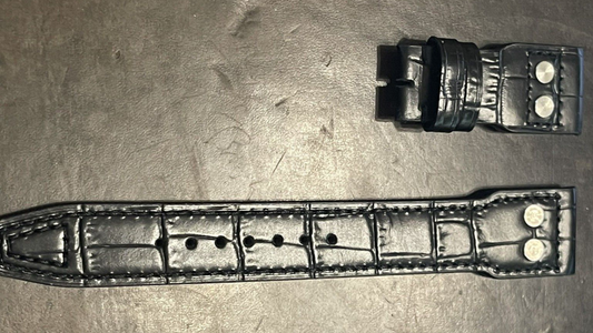 Black watch strap with two holes and a buckle, designed for premium quality IWC Big Pilot accessories.