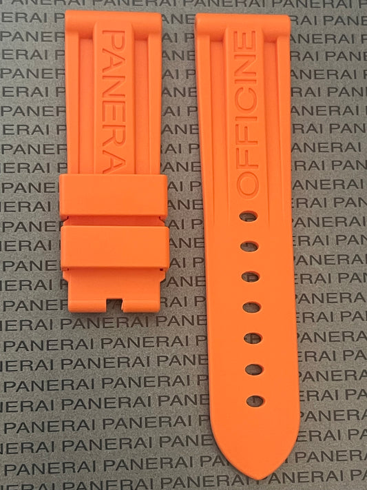 Panerai orange rubber watch strap with 'OFFICINE' embossing on textured Panerai background