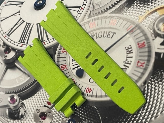 Bright green watch straps on background of watch faces and mechanisms