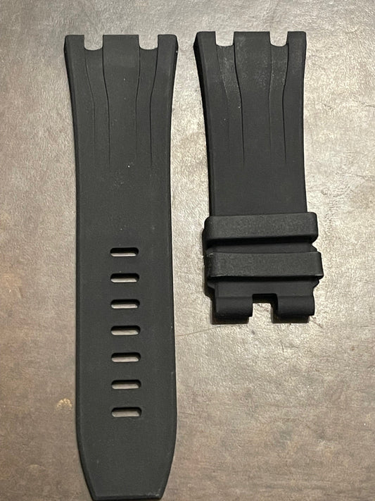 Two black silicone watch straps side by side, one with ventilation holes