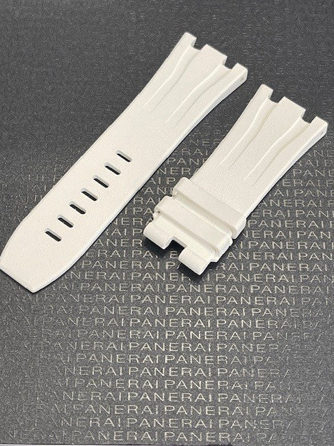 White watch straps displayed over PANERAI embossed dark surface