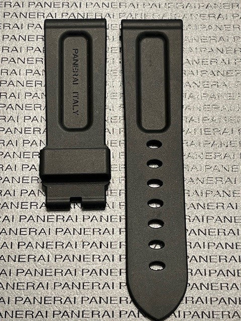 Panerai rubber watch strap in black featuring buckle and holes against branded backdrop