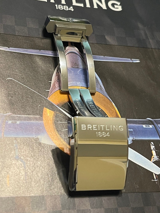 Breitling watch strap clasp featuring brand name and established year on display background
