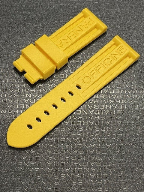 Bright yellow PANERAI rubber watch strap embossed with OFFICINE PANERAI on textured dark background