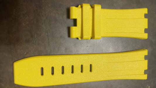A pair of yellow rubber watch straps, designed for watches with larger cases.