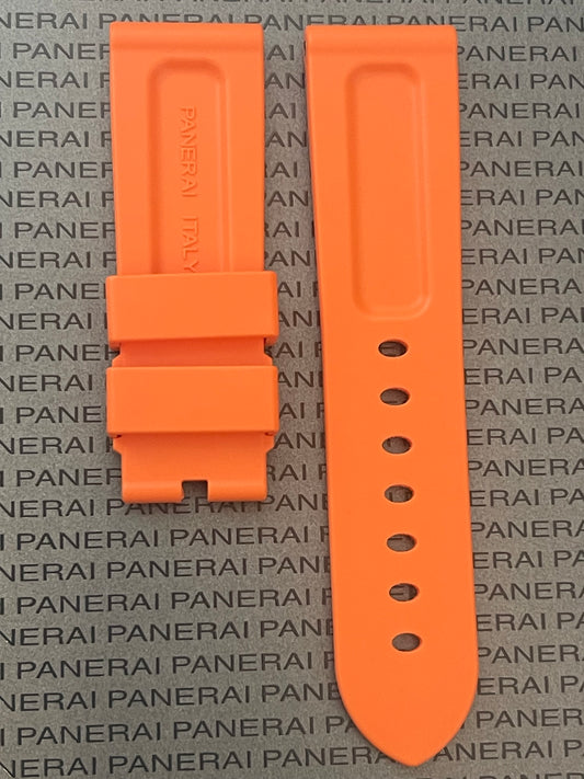 An orange Panerai watch strap displayed against a patterned background featuring the Panerai logo.