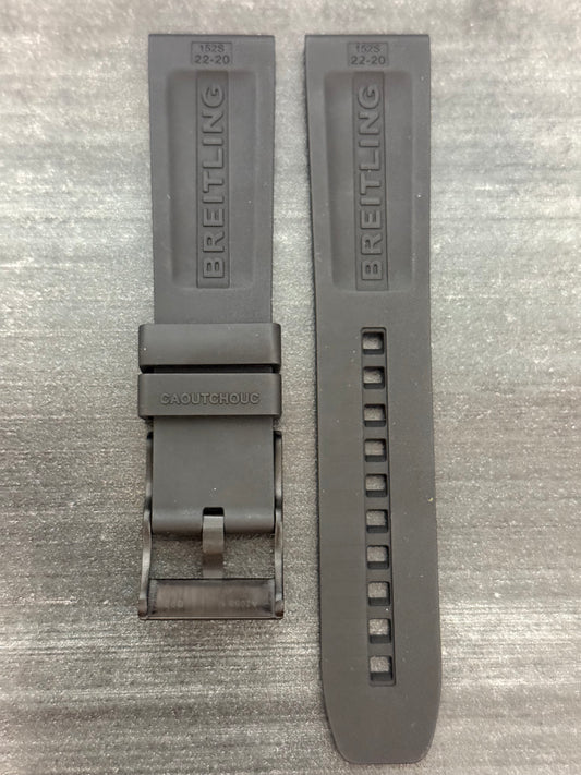 A grey watch strap featuring a silver buckle, showcasing a sleek and modern design.