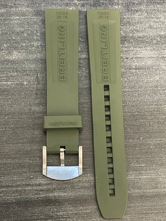 Green watch strap with metal buckle.