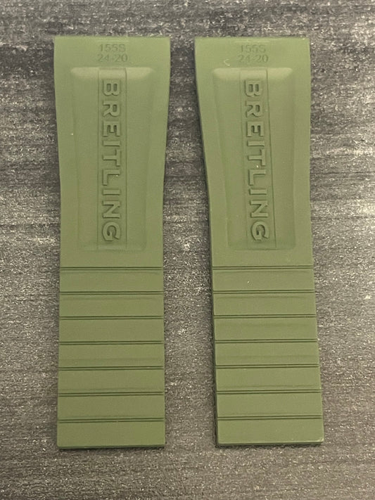 Two green watch straps featuring the word "Breitling" prominently displayed on each strap.
