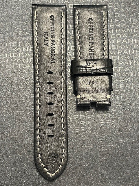 A black leather watch strap featuring contrasting white stitching for a stylish and modern look.