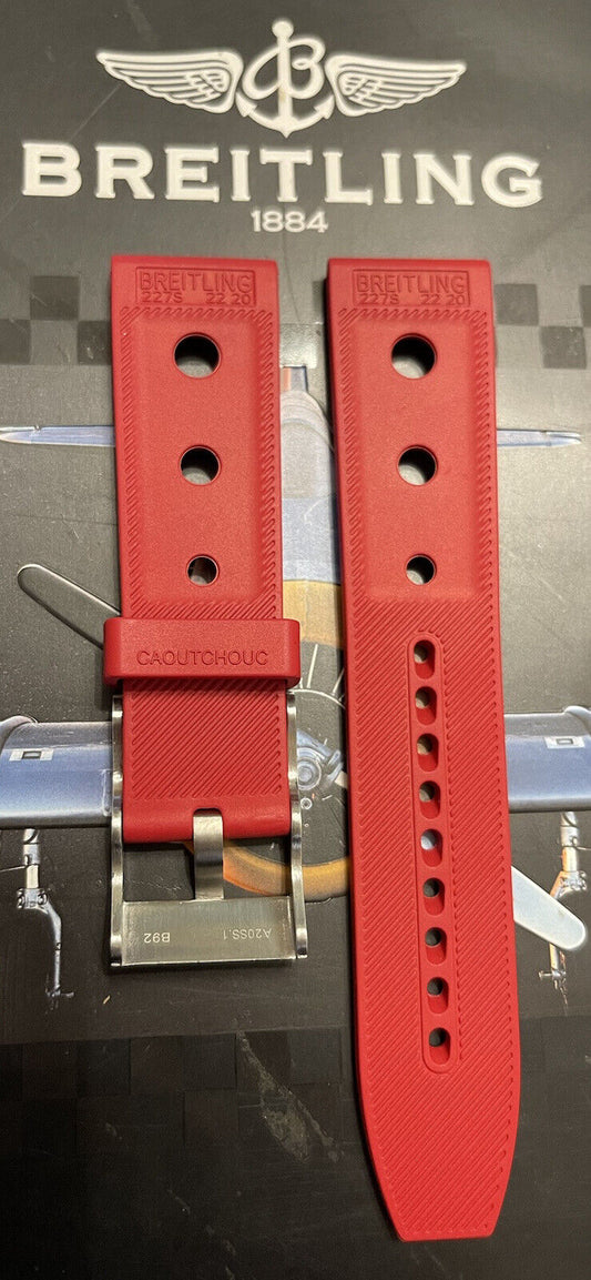 Breitling rubber watch strap in red with silver buckle and CAOUTCHOUC text on aviation background